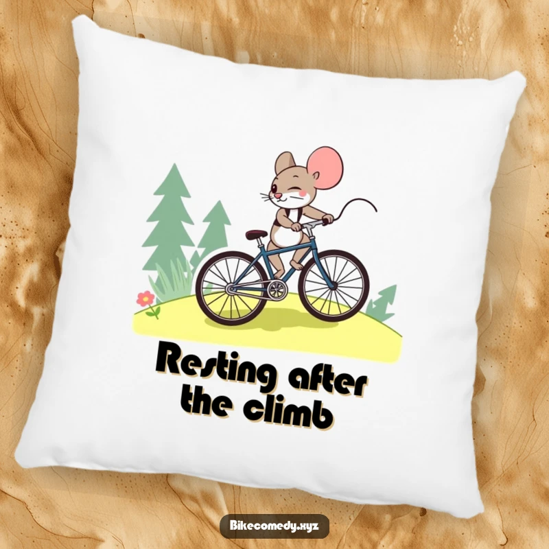 Funny mouse pillow showing a brave mouse struggling uphill on a bicycle, perfect for adding whimsical comfort and a message of resilience.