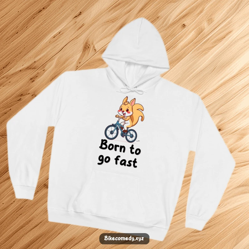 Funny squirrel hoodie illustrated with a joyful squirrel riding a bicycle downhill at high speed, radiating energy and carefree fun.