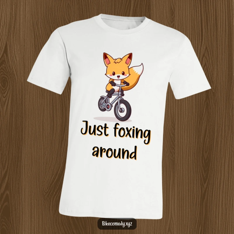 Funny fox t-shirt displaying a cunning fox executing a perfect wheelie on a small, precarious bicycle, radiating mischief and acrobatic fun.